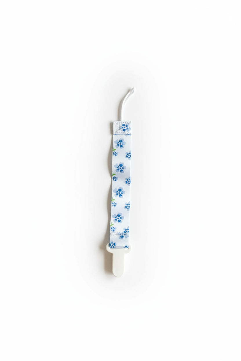 Attache à suce Blanche, Fleurs Bleue