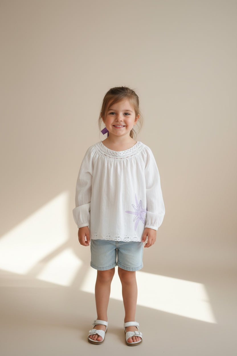 Blouse blanche avec étoile de mer
